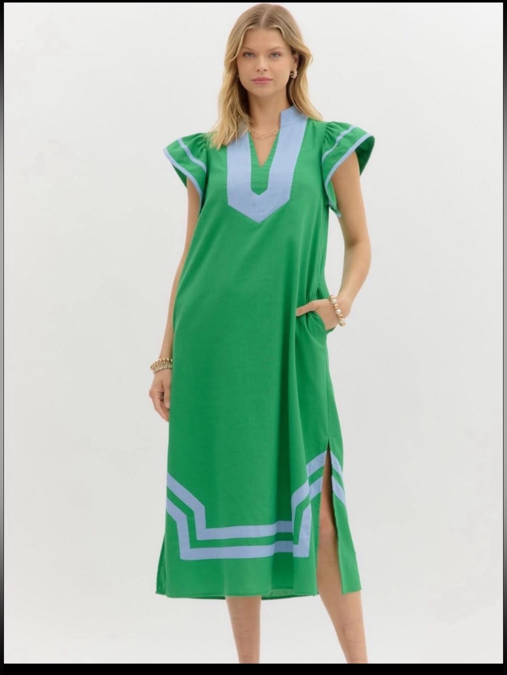 Entro green dress with contrasting light blue trim and notched V-neckline